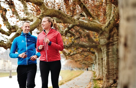 A man and a woman jogging.
