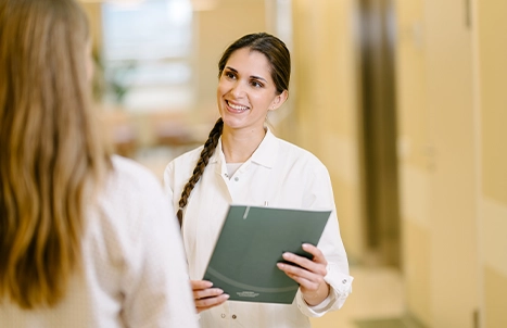 Two women in white coats
